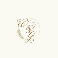 Initials WG wedding monogram logo with leaves and elegant circular lines vector