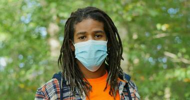 African American Man With Mask Looks At Camera Life During Covid 19 And Coronavirus video
