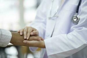 Kind doctor offering a loving gesture to a sick person during a health crisis. photo