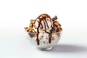 Top view of ice cream with chocolate and nuts in glass bowl isolated on white background photo