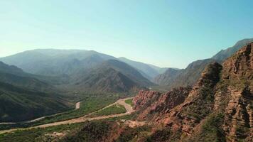 Aerial view drone flying over scenic red rocky mountains with a clear blue sky. video