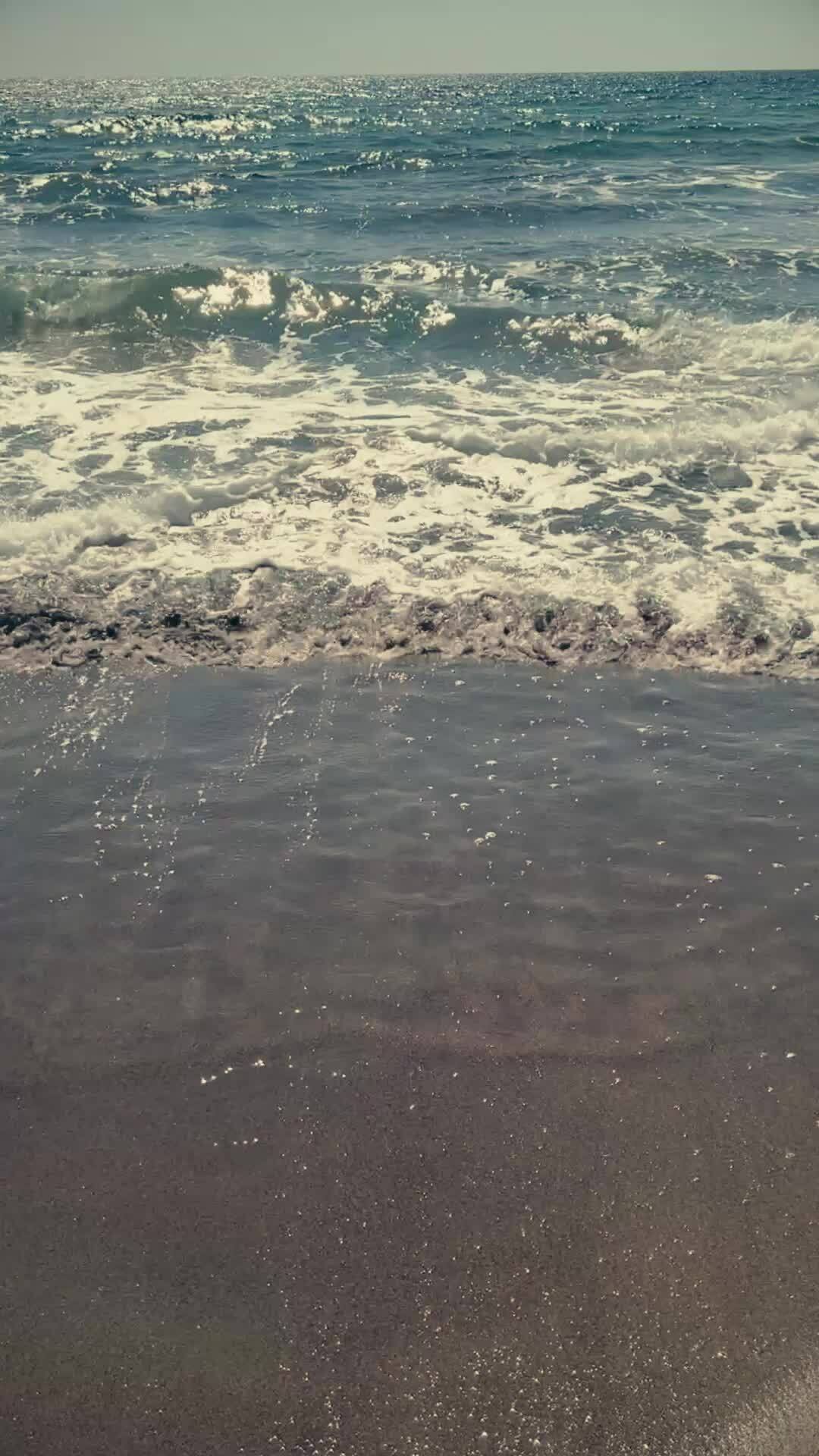 Vertical video of beach landscape, summer waves, paradise travel. South of  Spain 28197829 Stock Video at Vecteezy