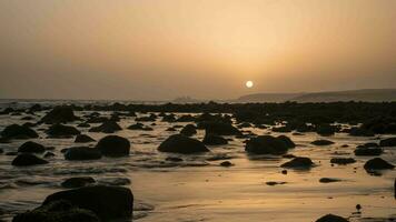 Timelapse of sea waves on coast with rocks at sunset video