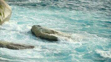 Turquoise waves rolled on the rocks, beach of Koh Miang island, Similan Islands, slow motion video