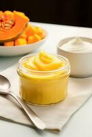 A close-up photo capturing the smooth creamy texture of pureed baby food transitioning into chunky textured meals