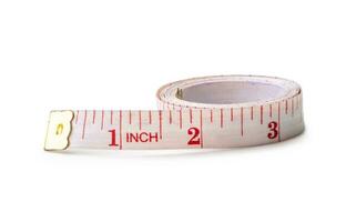 White rolling tape measure or tapeline with scale number isolated on white background with clipping path photo