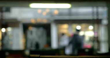 Defocused view of city street through the cafe window video