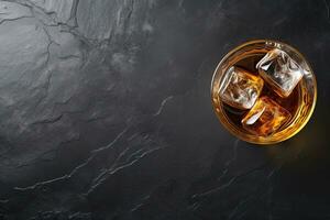 Whiskey with ice cubes on black marble background, top view.  Generative AI photo