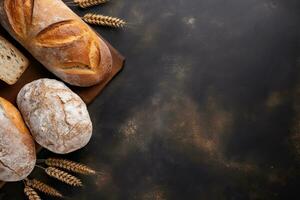 Freshly baked bread and wheat ears on rustic background. Top view with copy space. Generative AI photo