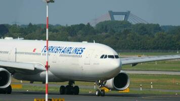 DUSSELDORF, GERMANY JULY 22, 2017 - Turkish Airlines Airbus A330 TC JNK taxiing before departure. Dusseldorf Airport, Germany video