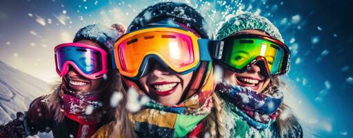 A group of skiers wearing ski goggles and gloves photo