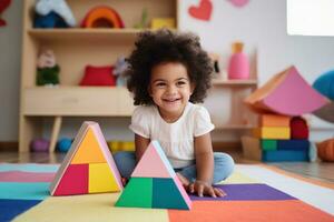 Cute kid in the living room building with blocks in the room photo