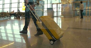 Walking with travel bag at the airport video