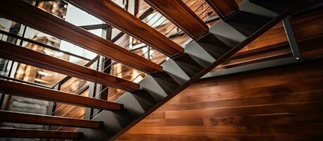 Luxurious home with a wooden and steel staircase viewed from below photo