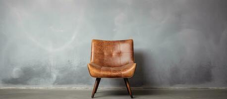 Brown chair alone on a grey backdrop photo