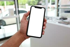 Phone, holding phone white screen, using mobile phone photo