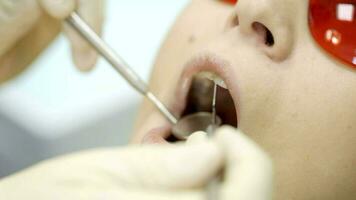 Woman being under dentists examination video