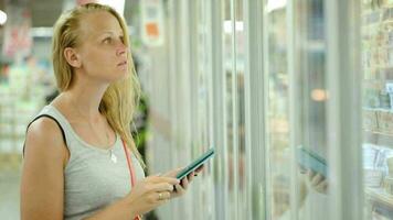 Woman going shopping with check list on pad video