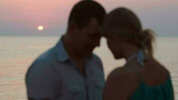 Loving couple on the beach during sunset video