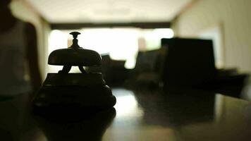 Woman ringing a bell on reception in hotel video