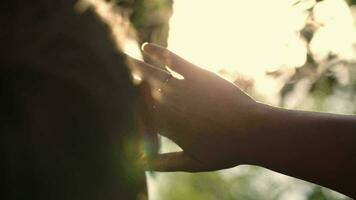 Woman looking far way hiding from the sun video