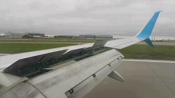 First person view from an airplane window. Landing, braking. Flaps up, speed down video