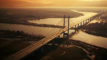 aéreo ver de enorme moderno puente terminado el río cerca puesta de sol. generar ai foto