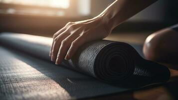 Close up of a womans hands is rolling up exercise mat and preparing to doing yoga. She is exercising on floor mat in morning sunshine at home, generative ai photo