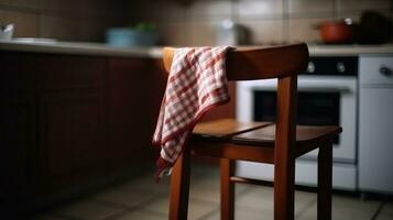 Close-up of kitchen chair with towel, napkin on spike against backdrop o kitchen interior. AI generated. photo