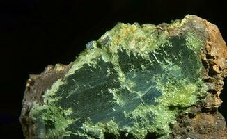 Olivenite is rare precious natural geological stone on gradient background in low key, isolate. AI generated. photo