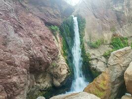 A refreshing waterfall in the Moroccan mountains photo