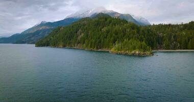 Aerial view of Harrison Lake and forest with mountain landscape on background video
