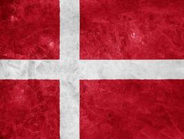 Flag of Denmark on a textured background. Concept collage. photo