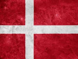 Flag of Denmark on a textured background. Concept collage. photo