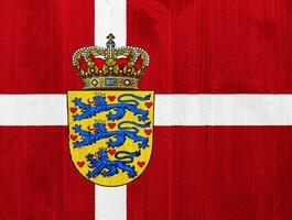Flag and coat of arms of Denmark on a textured background. Concept collage. photo
