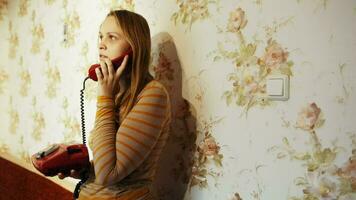 Young woman talking on the phone at home video