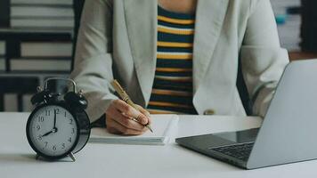 Businesswoman with tablet PC Follow the stock market in the stock market timing video