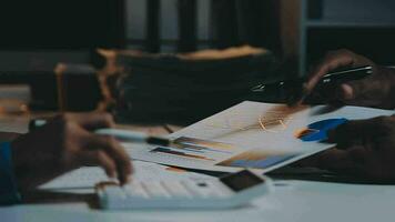 Team of business people working together in the meeting room office, teamwork background charts and graphs banner, double exposure successful teamwork,business planning concept. video