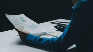 Team of business people working together in the meeting room office, teamwork background charts and graphs banner, double exposure successful teamwork,business planning concept. video