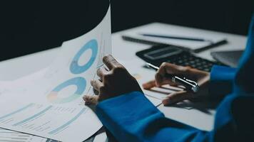 Team of business people working together in the meeting room office, teamwork background charts and graphs banner, double exposure successful teamwork,business planning concept. video