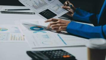 Team of business people working together in the meeting room office, teamwork background charts and graphs banner, double exposure successful teamwork,business planning concept. video