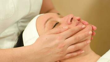 Massage of face at beauty treatment salon video