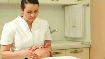 Facial treatment with a massage at beauty spa video