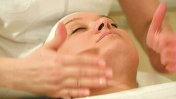 Woman taking facial treatments at beauty spa video