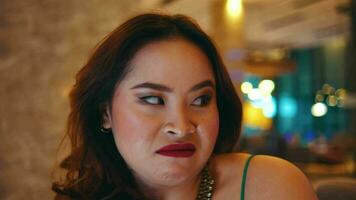 an Asian woman with an angry face and dislike when she sees someone in the hotel lobby video