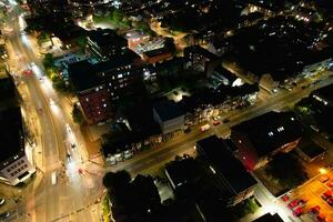 Aerial View of Illuminated Downtown Buildings, Roads and Central Luton City of England UK at Beginning of Clear Weather Night of September 5th, 2023 photo