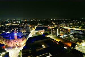 Aerial View of Illuminated Downtown Buildings, Roads and Central Luton City of England UK at Beginning of Clear Weather Night of September 5th, 2023 photo