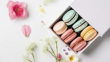 Colorful macaroons in present box with spring flowers on white background. AI Generative photo