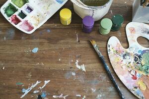 Close up of painting brushes in studio of artist. photo