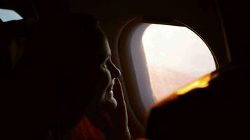 Woman talking on the phone in plane video